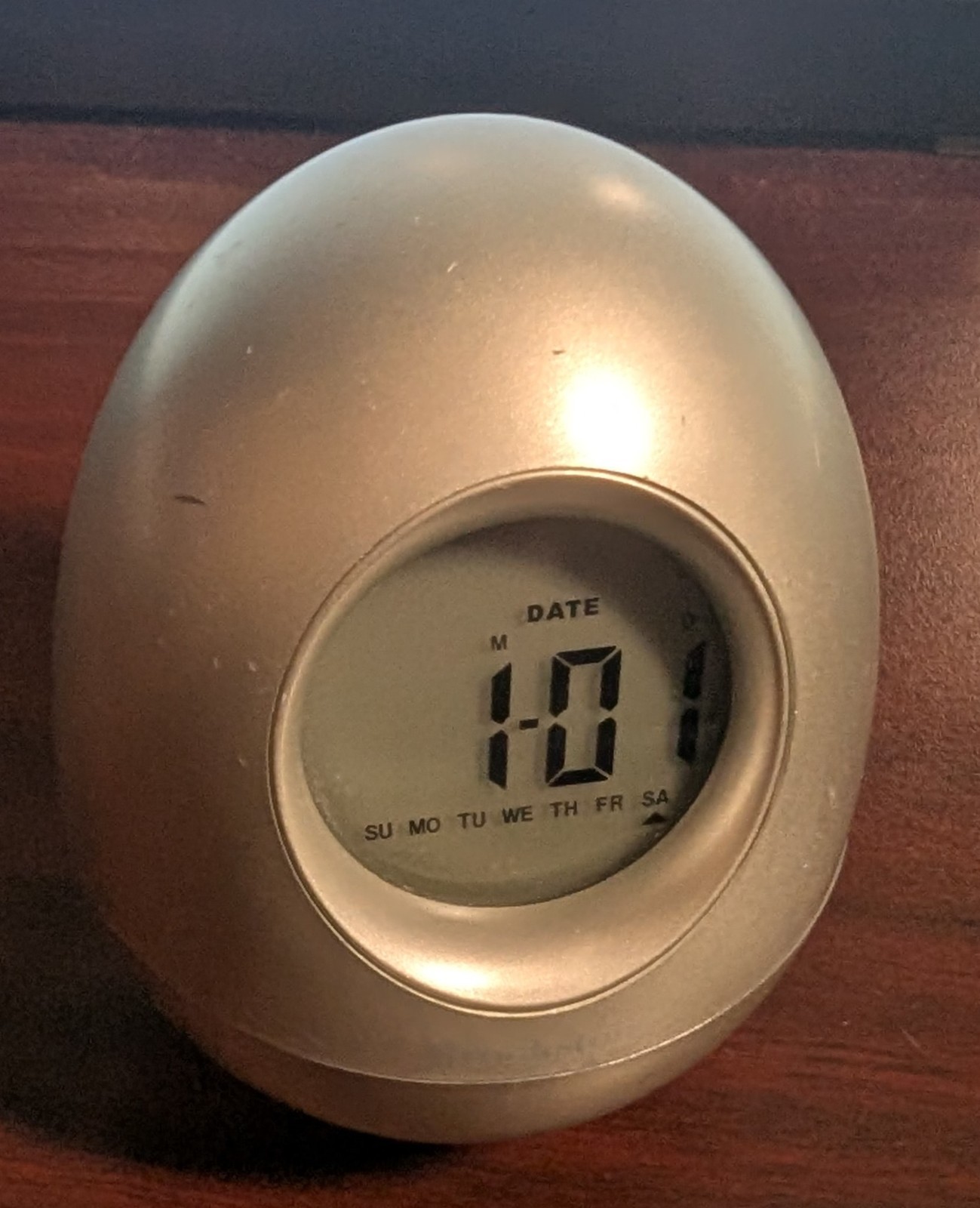 Brookstone Silver Oval Rocking Digital Alarm Clock gallery